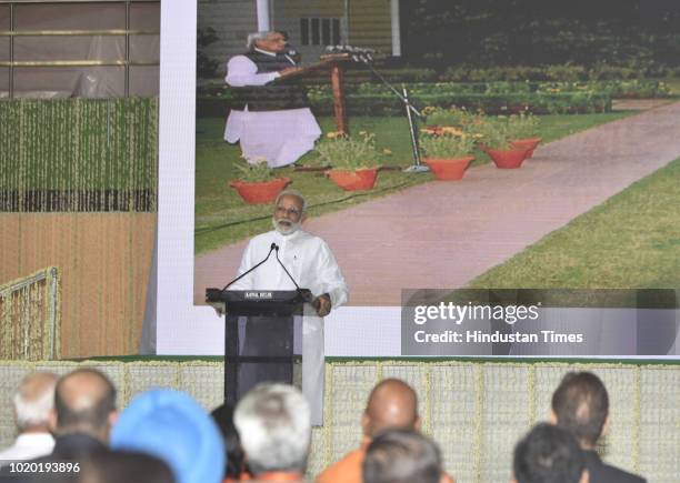 Prime Minister Narendra Modi speaks during an all party prayer meeting to pay homage to late Atal Bihari Vajpayee at Indira Gandhi Indoor Stadium on...