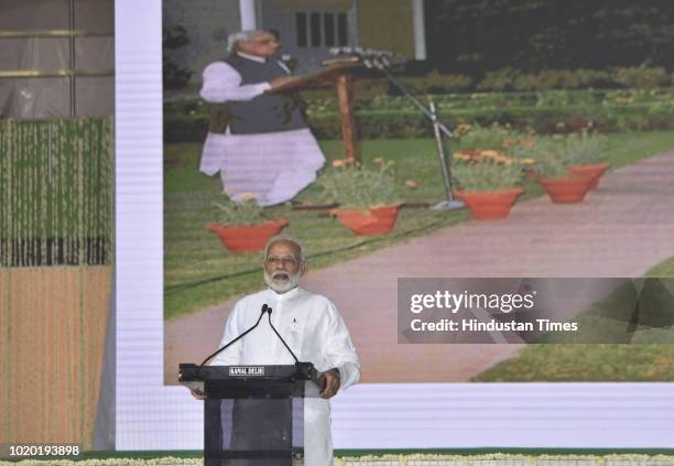 Prime Minister Narendra Modi speaks during an all party prayer meeting to pay homage to late Atal Bihari Vajpayee at Indira Gandhi Indoor Stadium on...