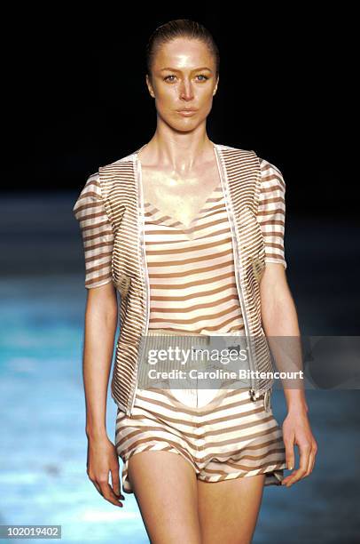 Raquel Zimmermann displays a design by Animale during the fourth day of the Sao Paulo Fashion Week Summer 2011 at the Ibirapuera's Bienal Pavilion on...
