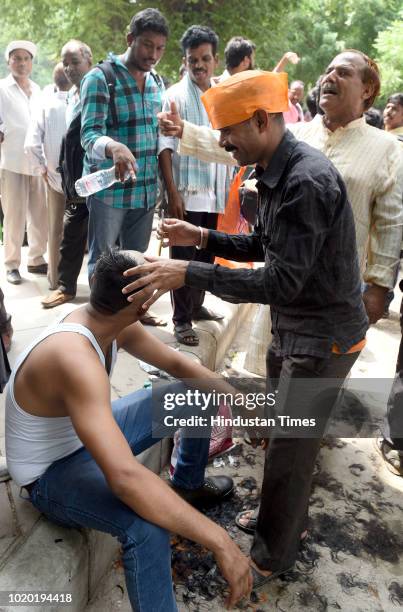 Workers of the Archaeological Survey of India led a protest by shouting slogans and shaving off their hair for their demands at Archaeological...