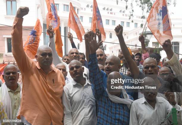 Workers of the Archaeological Survey of India led a protest by shouting slogans and shaving off their hair for their demands at Archaeological...