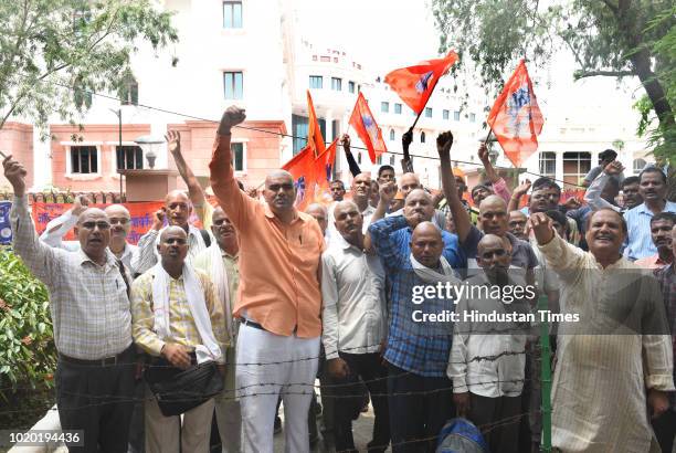 Workers of the Archaeological Survey of India led a protest by shouting slogans and shaving off their hair for their demands at Archaeological...