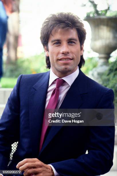 American actor John Travolta attends a photocall at the Dorchester hotel, London in 1983.