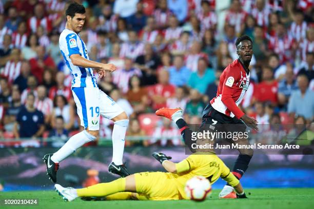 Inaki Williams of Athletic Club shoots the ball through Ivan Cuellar and Ezequiel Matias Munoz of CD Leganes during the La Liga match between...