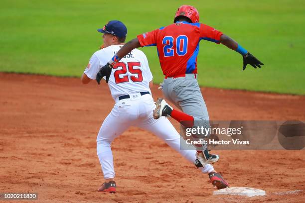 Brady House of United States tagged out Sebastian Bautista of Dominican Republic in the 4th inning during the WBSC U-15 World Cup Super Round match...