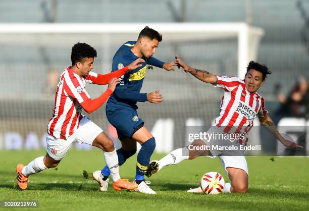 Mauro Zarate of Boca Juniors fights for the ball with Pablo Luguercio of Estudiantes during a match between Estudiantes and Boca Juniors as part of...