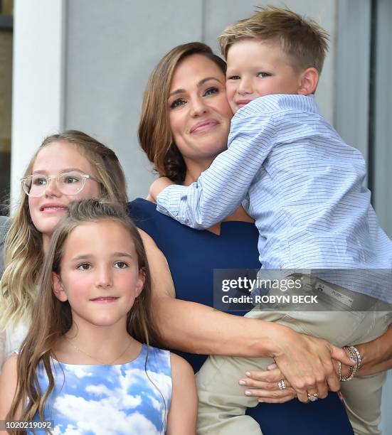 Actress Jennifer Garner poses with her children Violet Affleck, Seraphina Rose Elizabeth Affleck and Samuel Garner Affleck at her star on the...