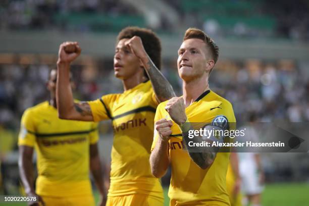 Marco Reus of Dortmund celebrates scoring the winning goal with his team mate Axel Witsel during the DFB Cup first round match between SpVgg Greuther...