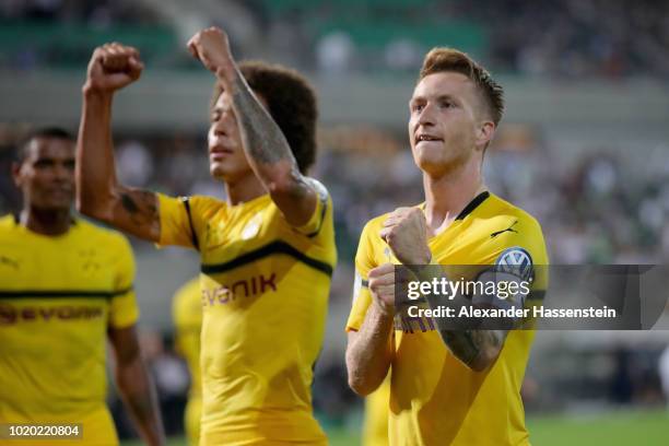 Marco Reus of Dortmund celebrates scoring the winning goal with his team mate Axel Witsel during the DFB Cup first round match between SpVgg Greuther...