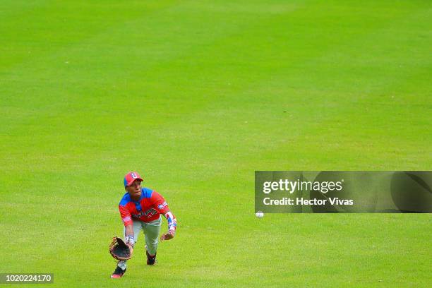 Anderson Suriel of Dominican Republic catches a ball in the 2nd inning during the WBSC U-15 World Cup Super Round match between Dominican Republic...