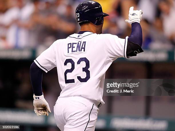 Infielder Carlos Pena of the Tampa Bay Rays celebrates his home run against the Florida Marlins during the game at Tropicana Field on June 12, 2010...