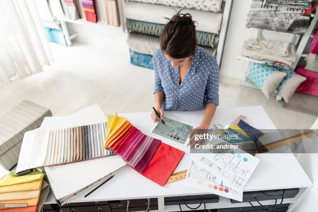 Interior Designer Working On A House Project And Choosing Fabrics At A ...