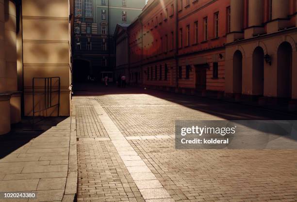 street at midday with harsh shadow - sunbeam city stock pictures, royalty-free photos & images