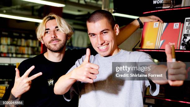 Callum Merrett and Ewan Merrett of Bad Sounds pose after performing live and signing copies of their debut album 'Get Better' during an instore...