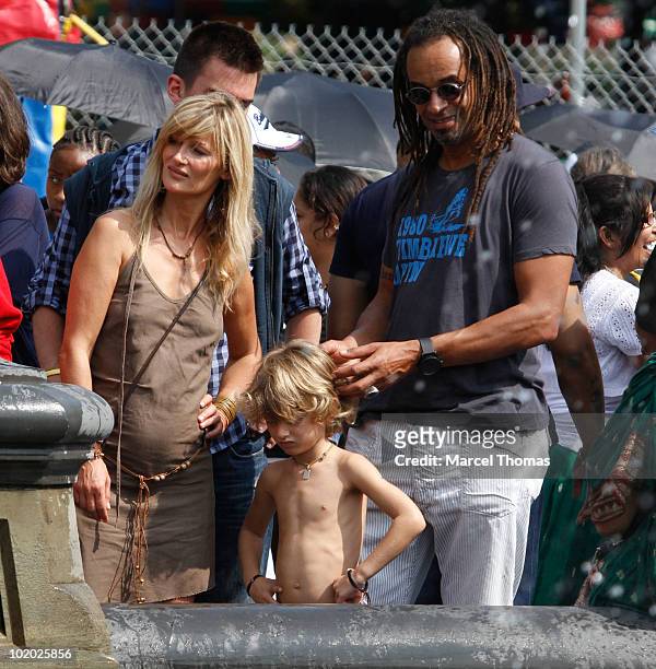 Tennis great Yannick Noah and wife Isabelle Camus are seen with son Joalukas Noah in Washington Square Park on June 12, 2010 in New York, New York.