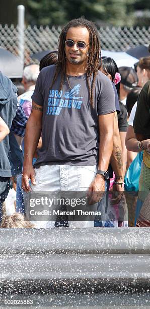 Tennis great Yannick Noah is seen sitting at the fountain in Washington Square Park on June 12, 2010 in New York, New York.