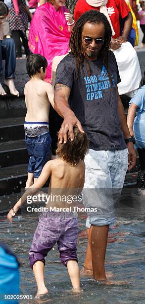 Tennis great Yannick Noah and son Joalukas Noah are seen at the fountain in Washington Square Park on June 12, 2010 in New York, New York.