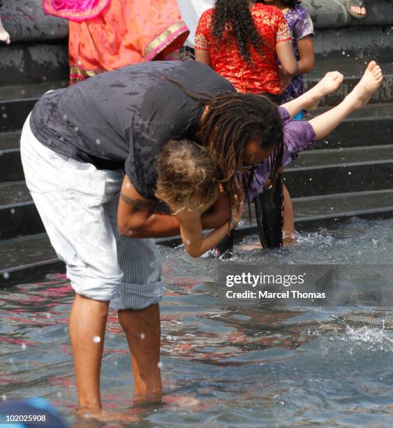 Tennis great Yannick Noah and son Joalukas Noah are seen at the fountain in Washington Square Park on June 12, 2010 in New York, New York.