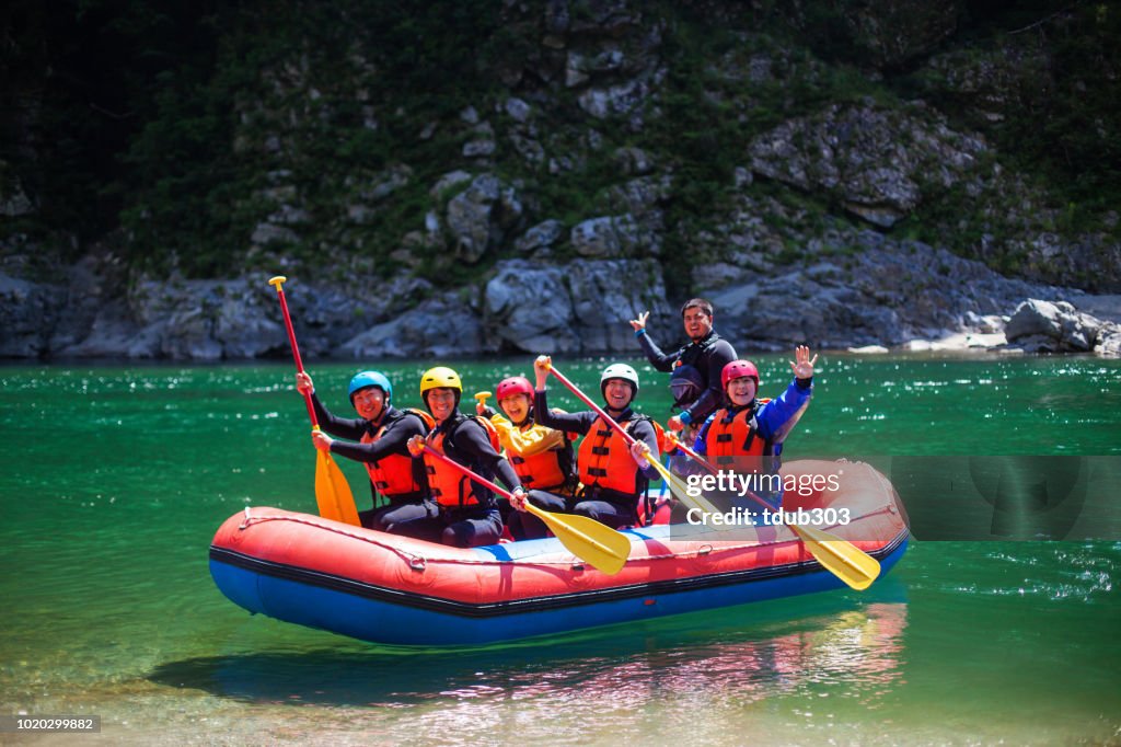 Woman In Inflatable Raft Group Of Men And Women In An Inflatable Raft On A River High-Res Stock ...