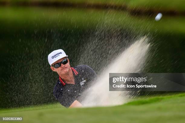 Brian Gay blasts from the sand trap on the 15th green during the final round of the Wyndham Championship on August 19, 2018 at Sedgefield Country...