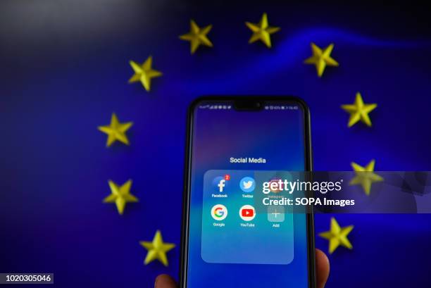 Social media apps with European Union flag are seen in this photo illustration. The European Commission is planning issue a regulation that allows to...