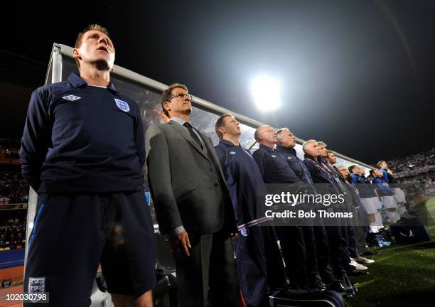 Fabio Capello coach of England and his assistant coach Stuart Pearce stand by their bench prior to the start of the 2010 FIFA World Cup South Africa...