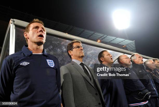 Fabio Capello coach of England and his assistant coach Stuart Pearce stand by their bench prior to the start of the 2010 FIFA World Cup South Africa...