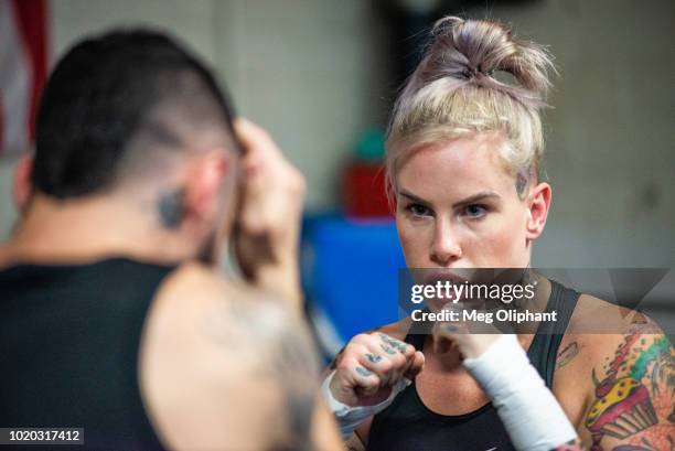 Australian UFC veteran and bare knuckle fighter Bec Rawlings demonstrates moves at City of Angels Boxing Club on August 16, 2018 in Los Angeles,...