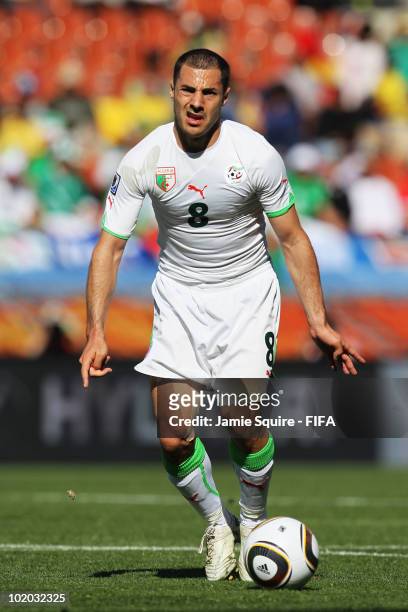 Medhi Lacen of Algeria runs with the ball during the 2010 FIFA World Cup South Africa Group C match between Algeria and Slovenia at the Peter Mokaba...