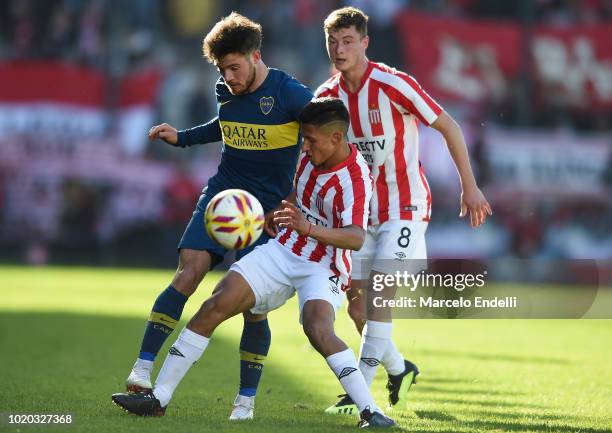 Nahitan Nandez of Boca Juniors fights for the ball with Ivan Gomez of Estudiantes during a match between Estudiantes and Boca Juniors as part of...