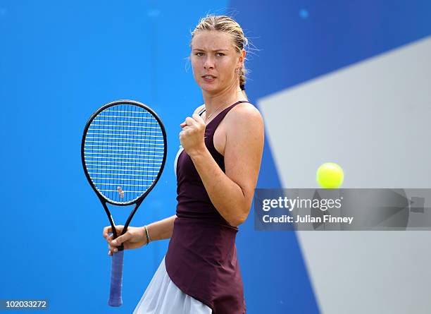 Maria Sharapova of Russia celebrates winning a point in her match against Na Li of China in the Women's Singles final during the AEGON Classic Tennis...