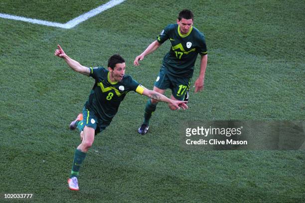 Robert Koren of Slovenia celebrates after scoring the first goal during the 2010 FIFA World Cup South Africa Group C match between Algeria and...