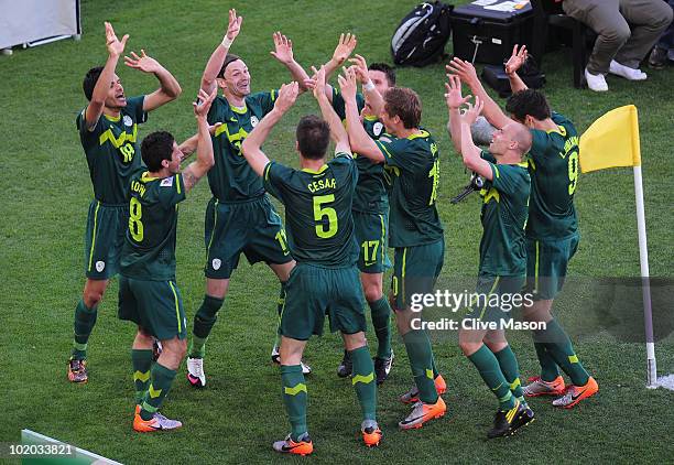 The Slovenian team celebrates after victory in the 2010 FIFA World Cup South Africa Group C match between Algeria and Slovenia at the Peter Mokaba...