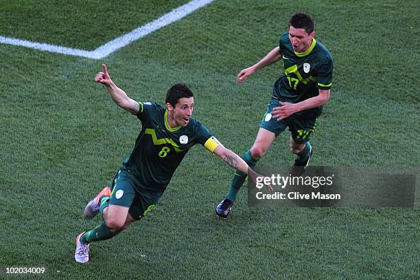 Robert Koren of Slovenia celebrates with teammate Andraz Kirm after scoring the first goal during the 2010 FIFA World Cup South Africa Group C match...