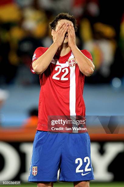 Zdravko Kuzmanovic of Serbia reacts after handling the ball and giving away a penalty during the 2010 FIFA World Cup South Africa Group D match...
