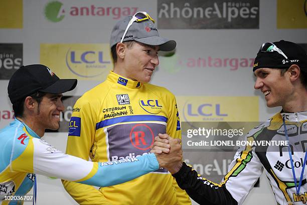 Spanish Alberto Contador, Slovenia's Janez Brajkovic and US' Tejay Van Garderen are seen on the podium on June 13 after the 148 km stage run between...