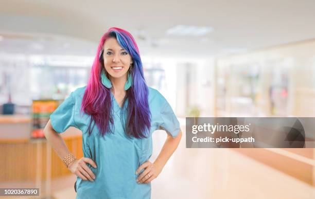 happy hip nurse - dyed hair stock pictures, royalty-free photos & images