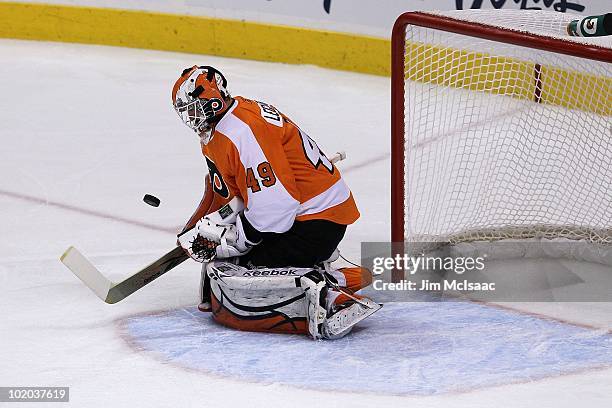 Michael Leighton of the Philadelphia Flyers handles the puck against the Chicago Blackhawks in Game Six of the 2010 NHL Stanley Cup Final at the...