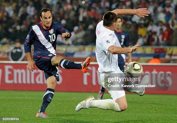 Landon Donovan of USA takes a shot on goal as John Terry of England defends during the 2010 FIFA World Cup South Africa Group C match between England...