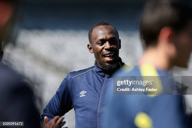 Usain Bolt warms up during Usain Bolt's first training session with the Central Coast Mariners A-League squad at Central Coast Stadium on August 21,...