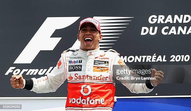 Lewis Hamilton of Great Britain and McLaren Mercedes celebrates on the podium after winning the Canadian Formula One Grand Prix at the Circuit Gilles...