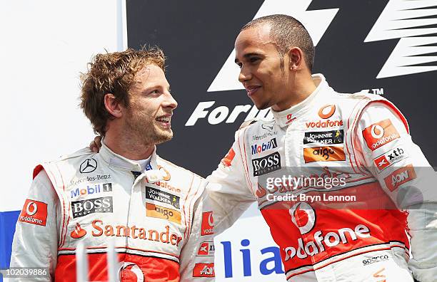 Race winner Lewis Hamilton of Great Britain and McLaren Mercedes celebrates with second placed Jenson Button of Great Britain and McLaren Mercedes on...