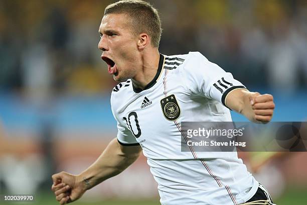 Lukas Podolski of Germany celebrates scoring the first goal during the 2010 FIFA World Cup South Africa Group D match between Germany and Australia...