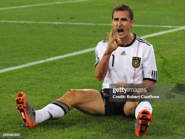 Miroslav Klose of Germany celebrates as he scores his side's second goal during the 2010 FIFA World Cup South Africa Group D match between Germany...