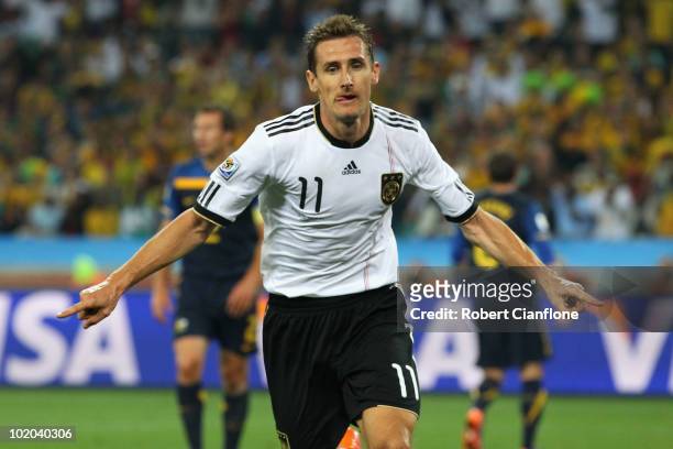 Miroslav Klose of Germany celebrates as he scores his side's second goal during the 2010 FIFA World Cup South Africa Group D match between Germany...
