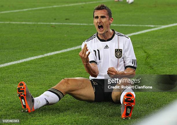 Miroslav Klose of Germany celebrates after he scores his side's second goal during the 2010 FIFA World Cup South Africa Group D match between Germany...