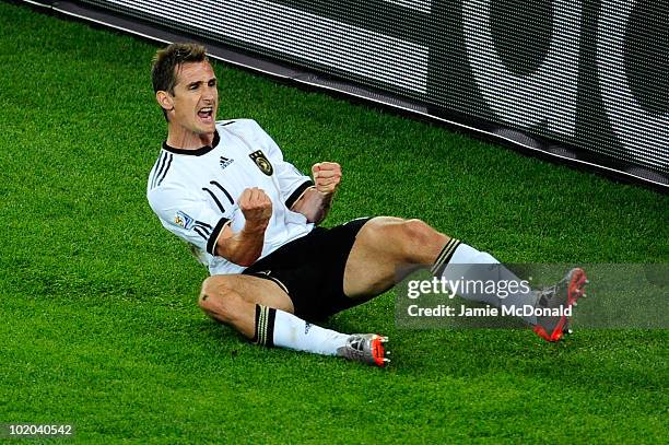 Miroslav Klose of Germany celebrates after he scores his side's second goal during the 2010 FIFA World Cup South Africa Group D match between Germany...