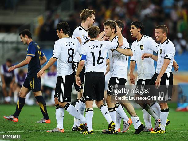 Germany players celebrate after Thomas Mueller of Germany scores his side's third goal during the 2010 FIFA World Cup South Africa Group D match...