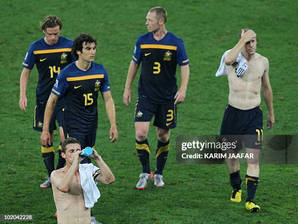 Australia's striker Brett Holman, Australia's midfielder Mile Jedinak, Australia's defender Craig Moore and Australia's defender Scott Chipperfield...