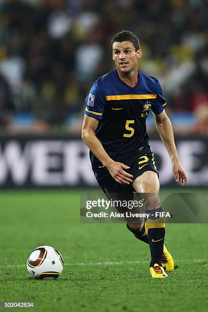 Jason Culina of Australia runs with the ball during the 2010 FIFA World Cup South Africa Group D match between Germany and Australia at Durban...